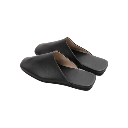 Capricornus Living Black closed-toe genuine leather house slippers on a transparent background