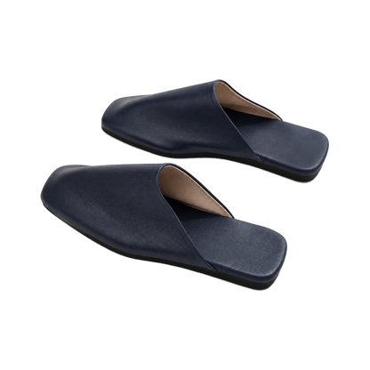Capricornus Living Deep Navy closed-toe genuine leather house slippers on a transparent background