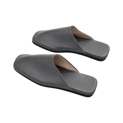 Capricornus Living Charcoal Gray closed-toe genuine leather house slippers on a transparent background