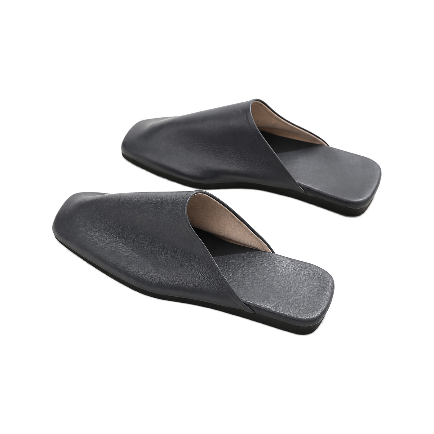 Capricornus Living Black closed-toe genuine leather house slippers from an alternate angle on a transparent background