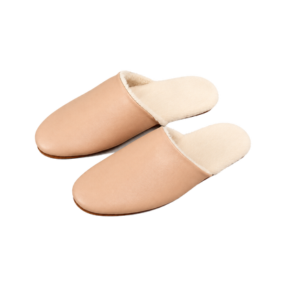 Capricornus Living Blush Beige genuine lambskin plush-lined house slippers on a transparent background
