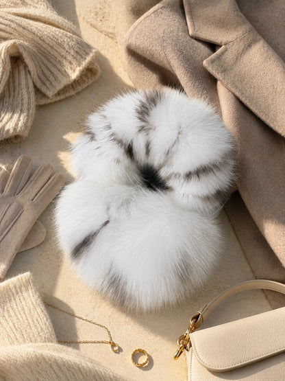 White Leopard fox fur earmuffs styled with neutral winter accessories