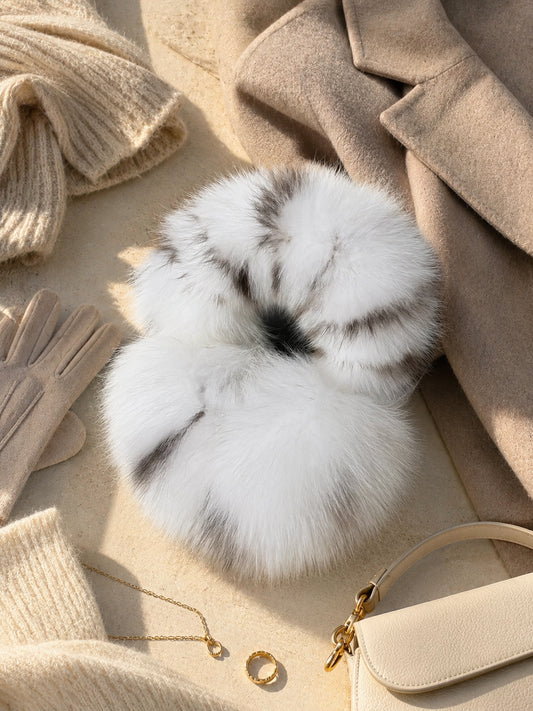 White Leopard fox fur earmuffs styled with neutral winter accessories