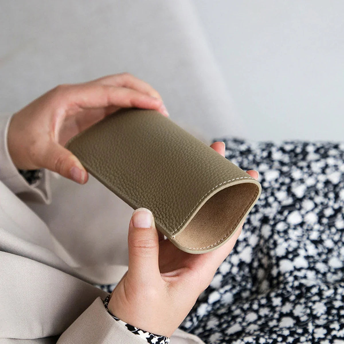Open-end construction of the pebbled cowhide eyeglass sleeve