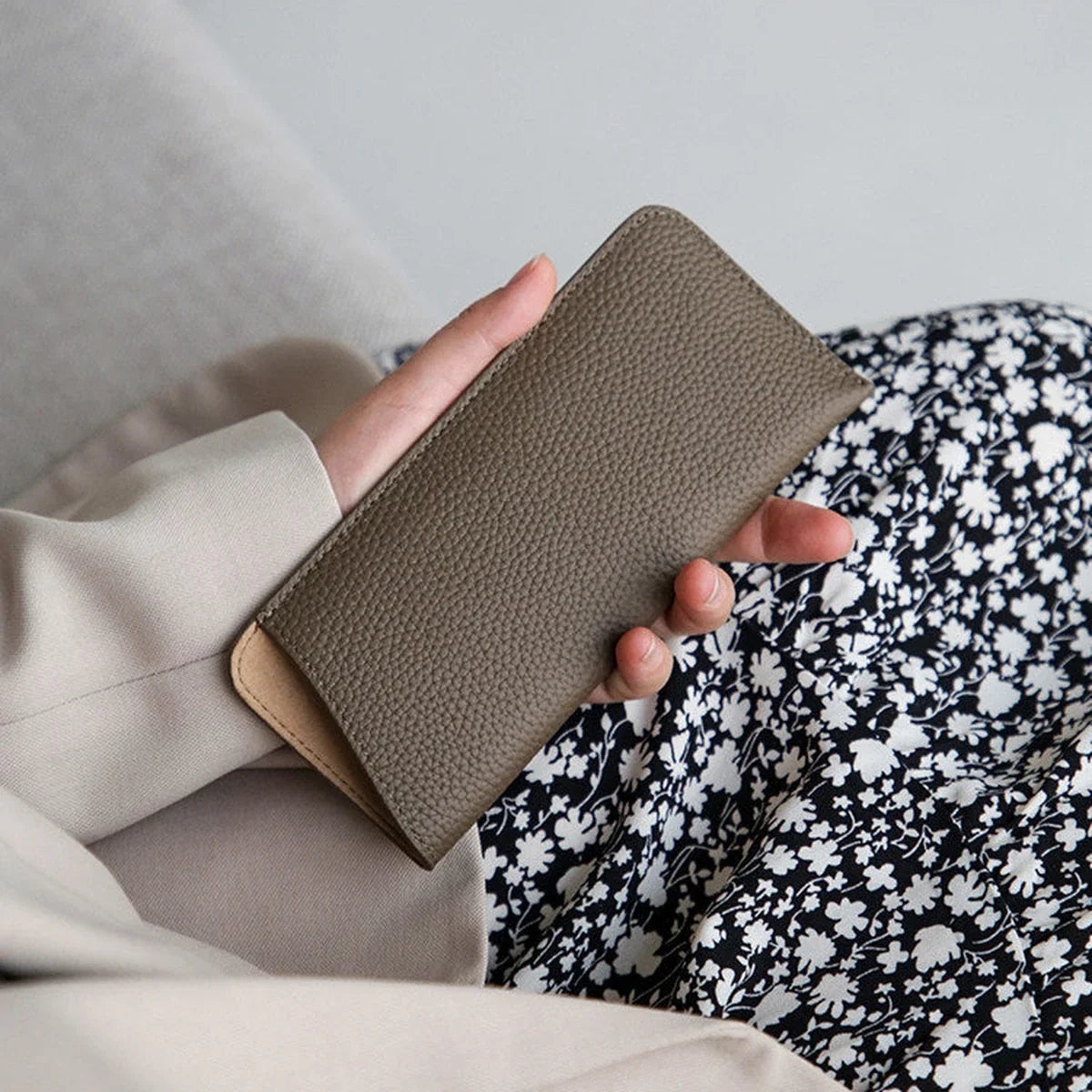 Slim profile of the Dove Gray pebbled cowhide eyeglass sleeve