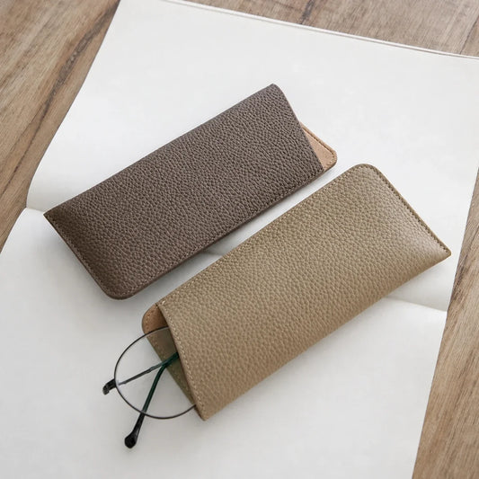 Pebbled cowhide eyeglass sleeves in Khaki Gray and Dove Gray