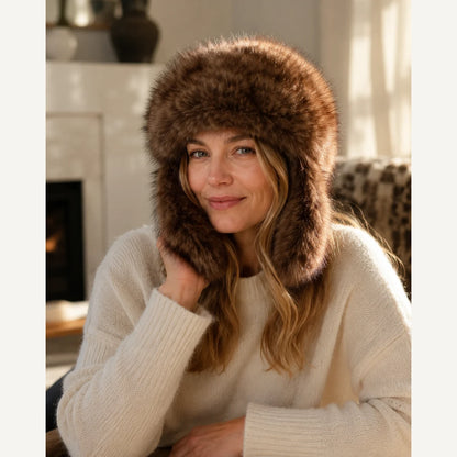 Deep Sable Brown genuine sable fur trapper hat worn by fireplace