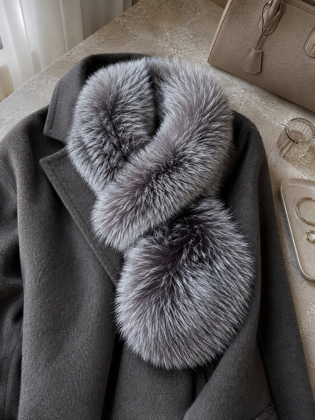 Natural Silver Fox scarf styled on a charcoal coat