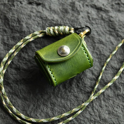 Forest Green cowhide earbud case with sun medallion and neck cord