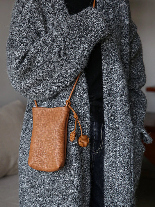 Cognac Brown leather phone crossbody bag styled with a knit cardigan