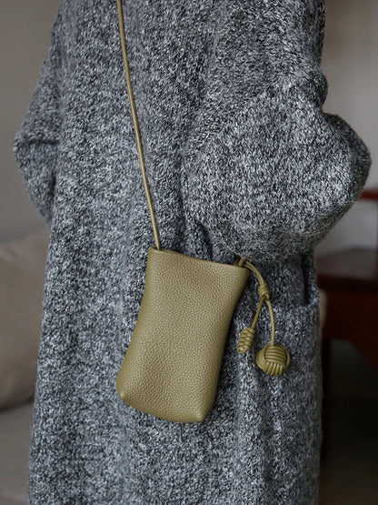 Sage Green leather phone pouch worn crossbody