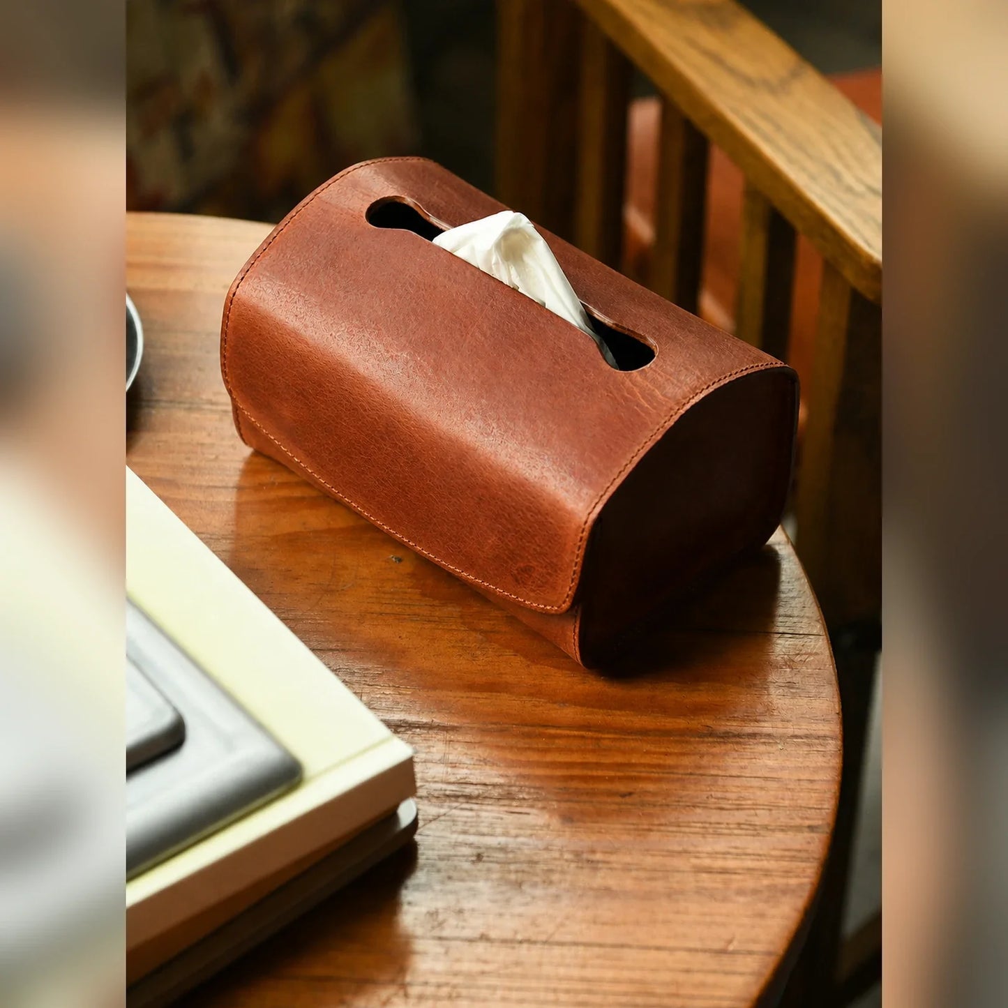 Sunset Tan top-grain cowhide tissue box cover styled on a wooden side table