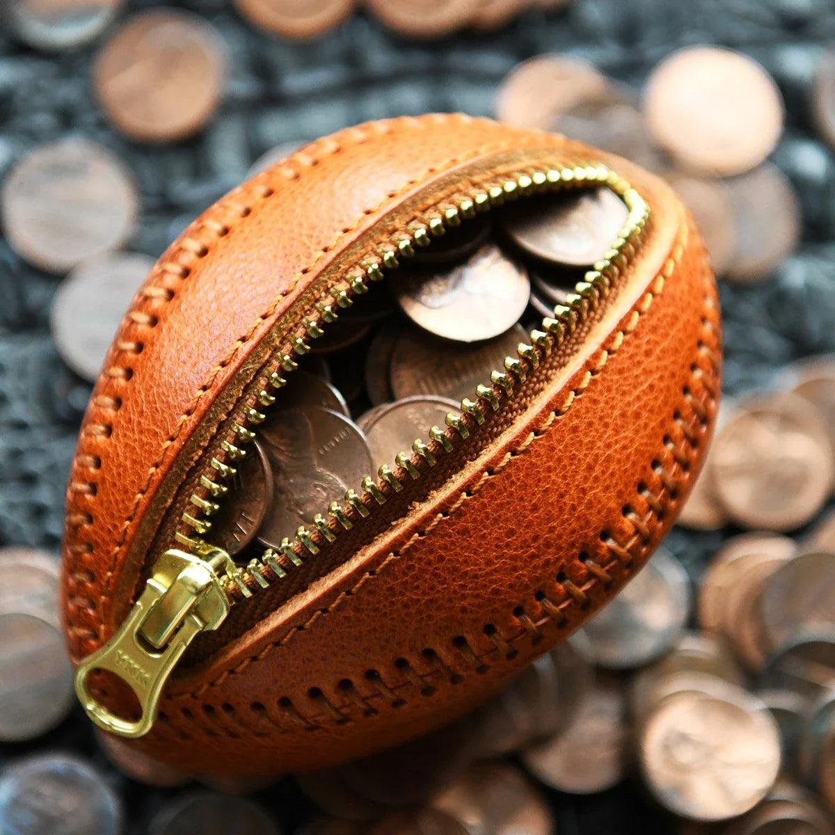 Leather rugby coin pouch open with coins inside
