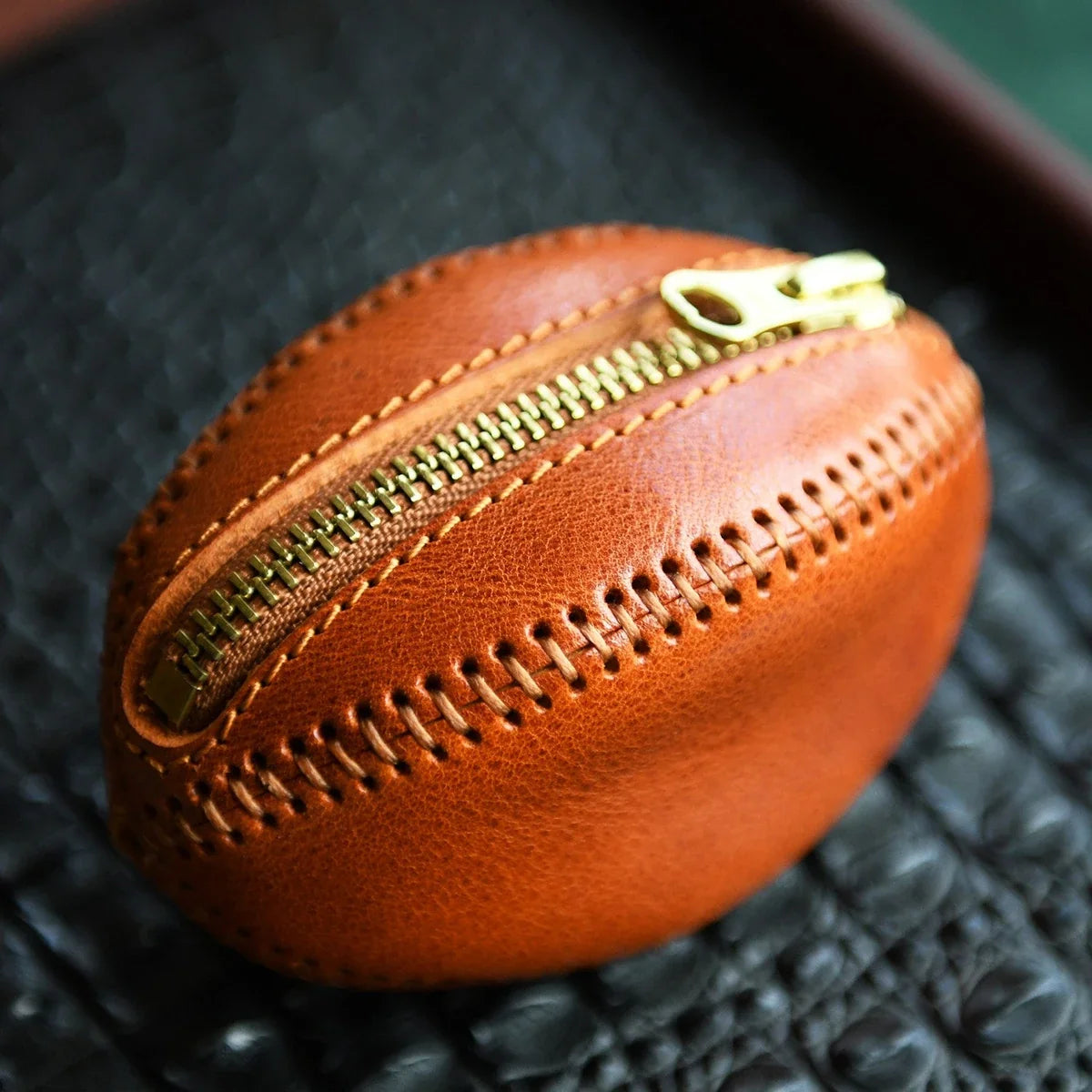 Brown top-grain leather rugby coin and earbud pouch