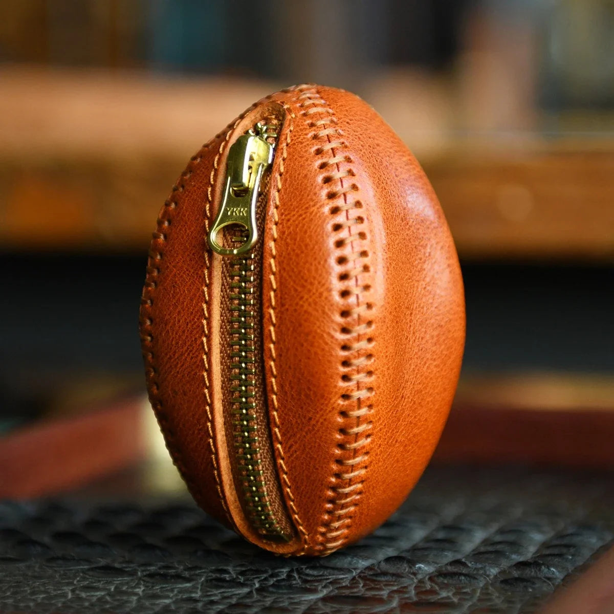 Hand-stitched top-grain leather rugby coin pouch standing upright