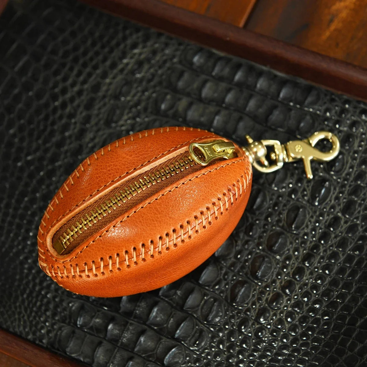 Brown leather rugby pouch with detachable hook