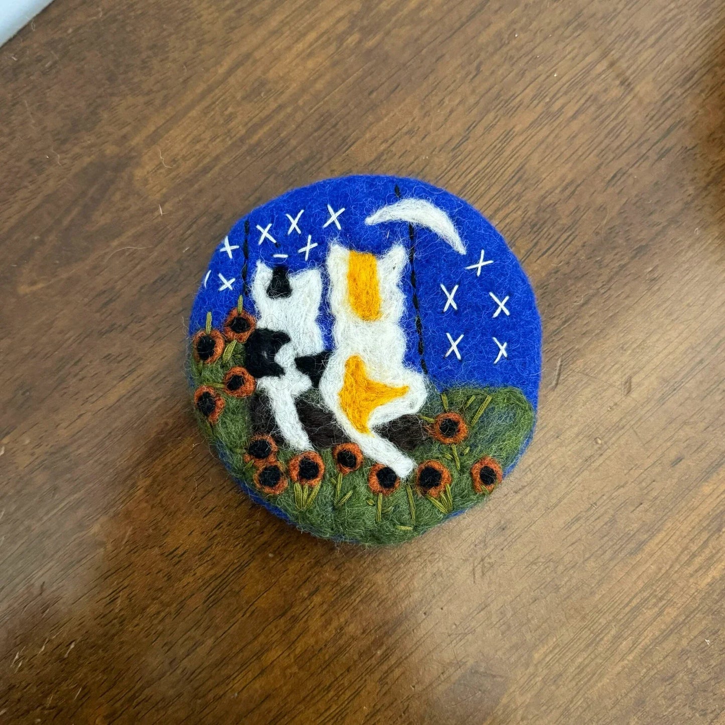 Two Cats wool felt coaster with a deep blue night sky