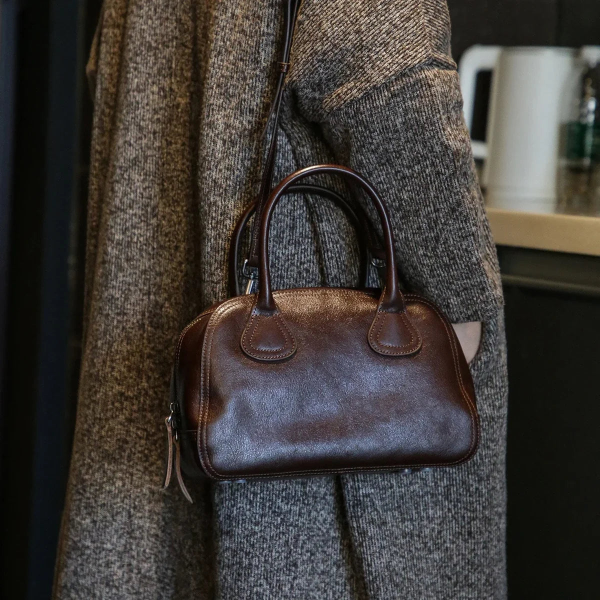 Ebony Brown vegetable-tanned cowhide bowling bag worn crossbody