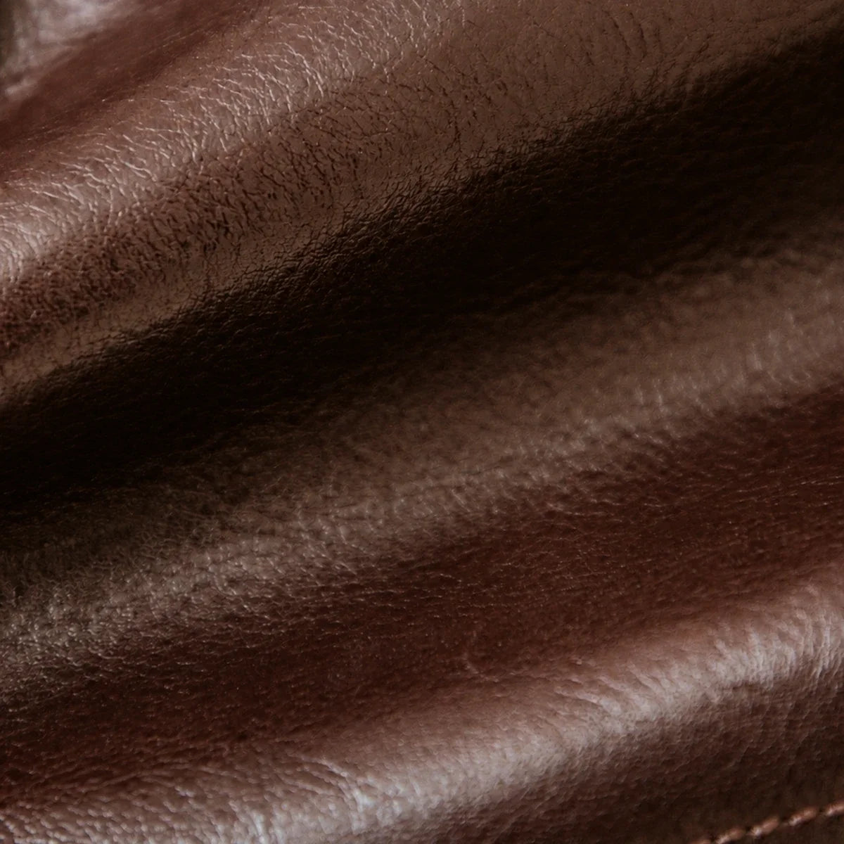 Close view of vegetable-tanned cowhide grain and stitching