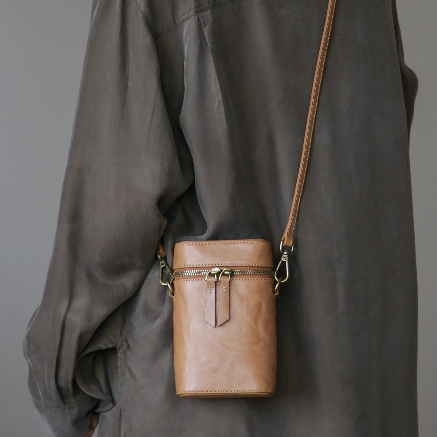 Chestnut Brown vegetable-tanned cowhide phone crossbody bag worn over the shoulder