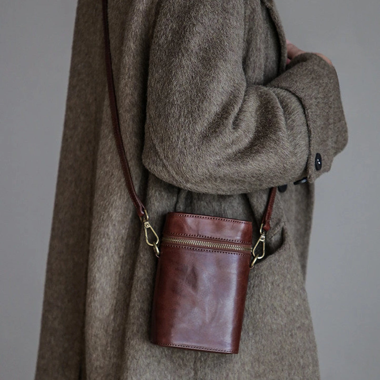 Coffee Brown vegetable-tanned cowhide phone crossbody bag in a full styling view