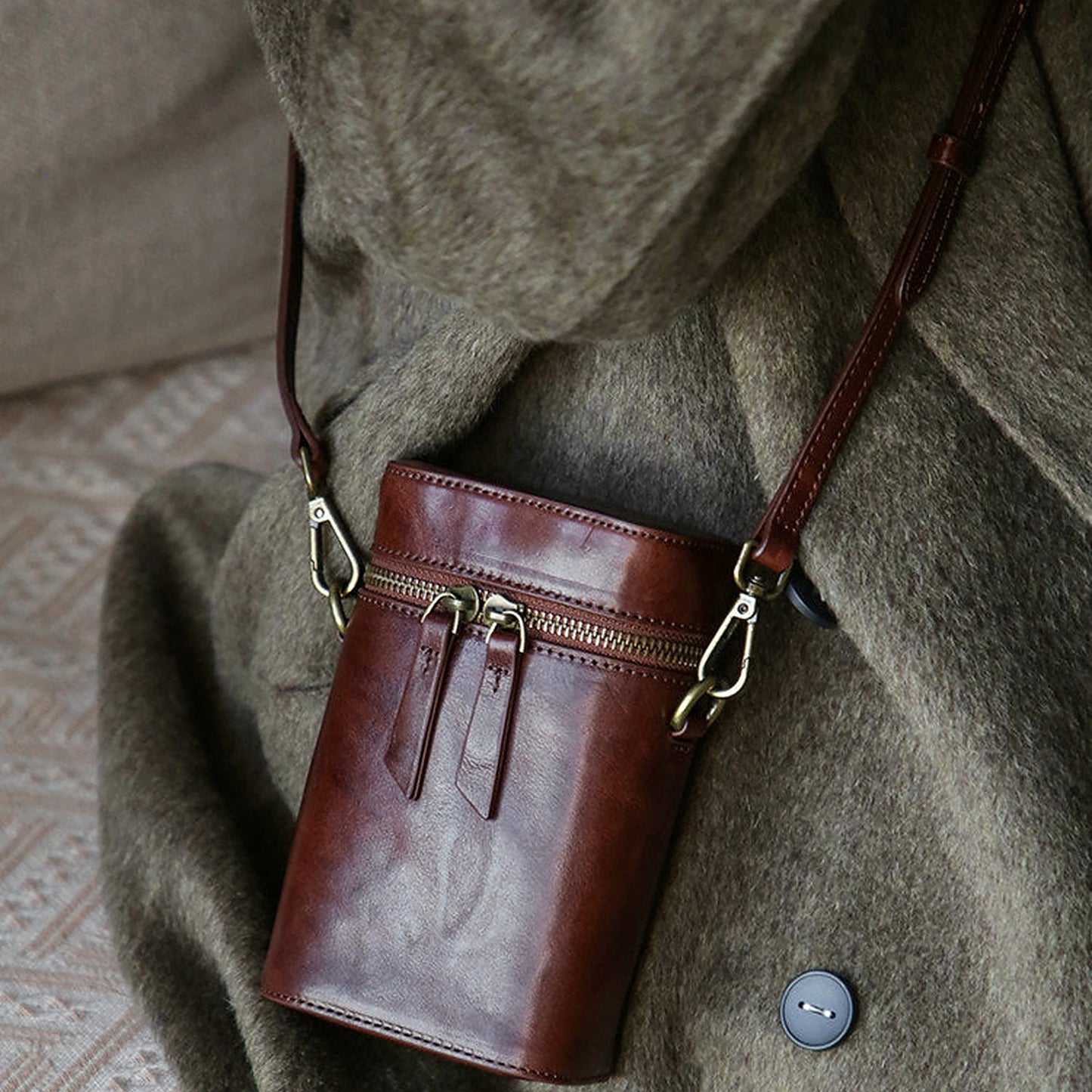 Vegetable-tanned cowhide vertical phone crossbody bag styled in warm brown