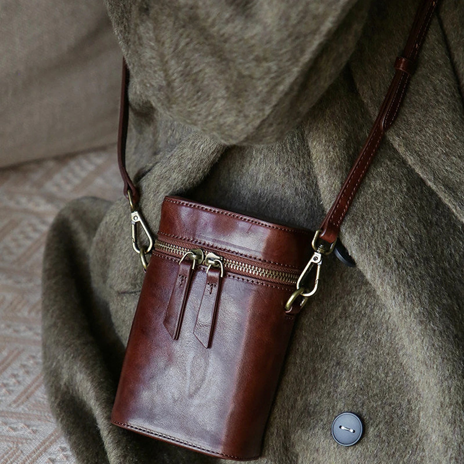 Vegetable-tanned cowhide vertical phone crossbody bag styled in warm brown