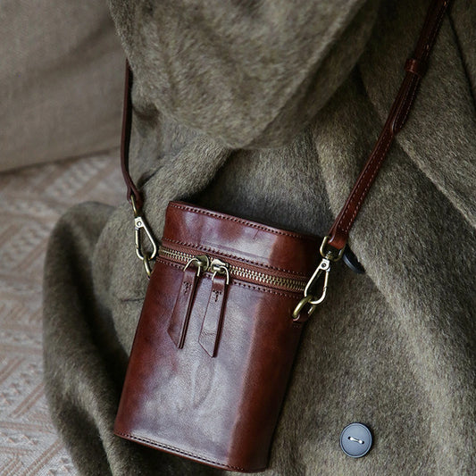 Vegetable-tanned cowhide vertical phone crossbody bag styled in warm brown