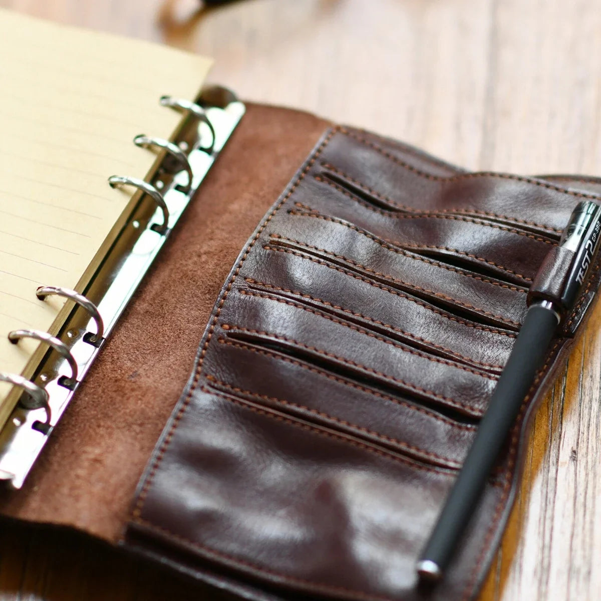 A6 leather ring journal interior with card slots and lined paper