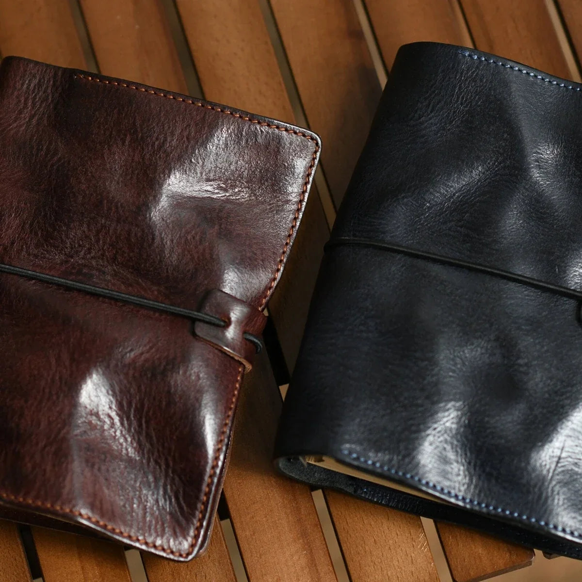 Coffee brown and deep navy leather A6 journals styled together