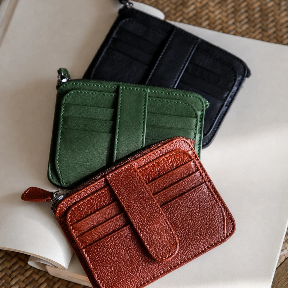 Vegetable-tanned cowhide wallet in Cognac Brown, Forest Green and Black