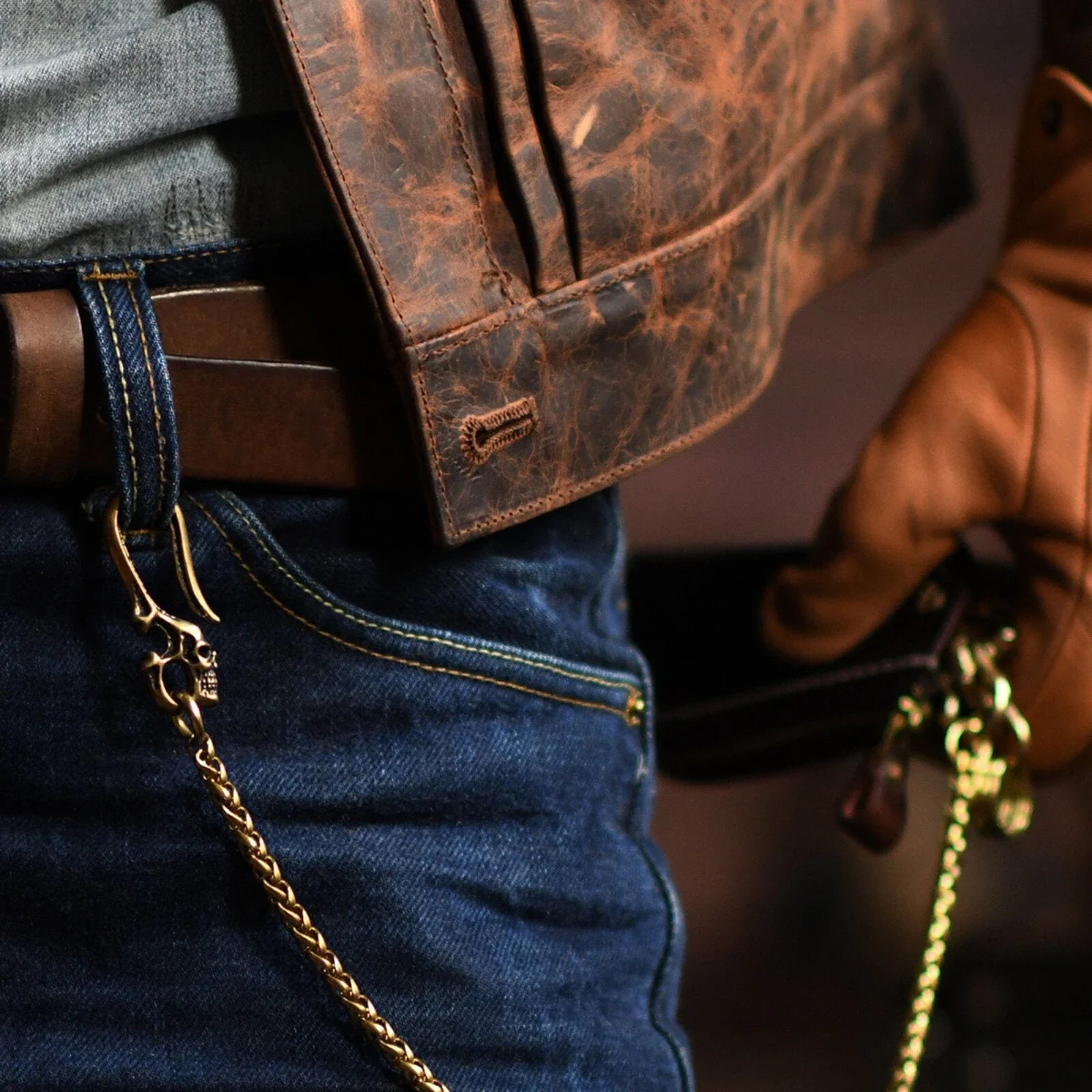 Vintage metal wallet chain styled with denim and leather