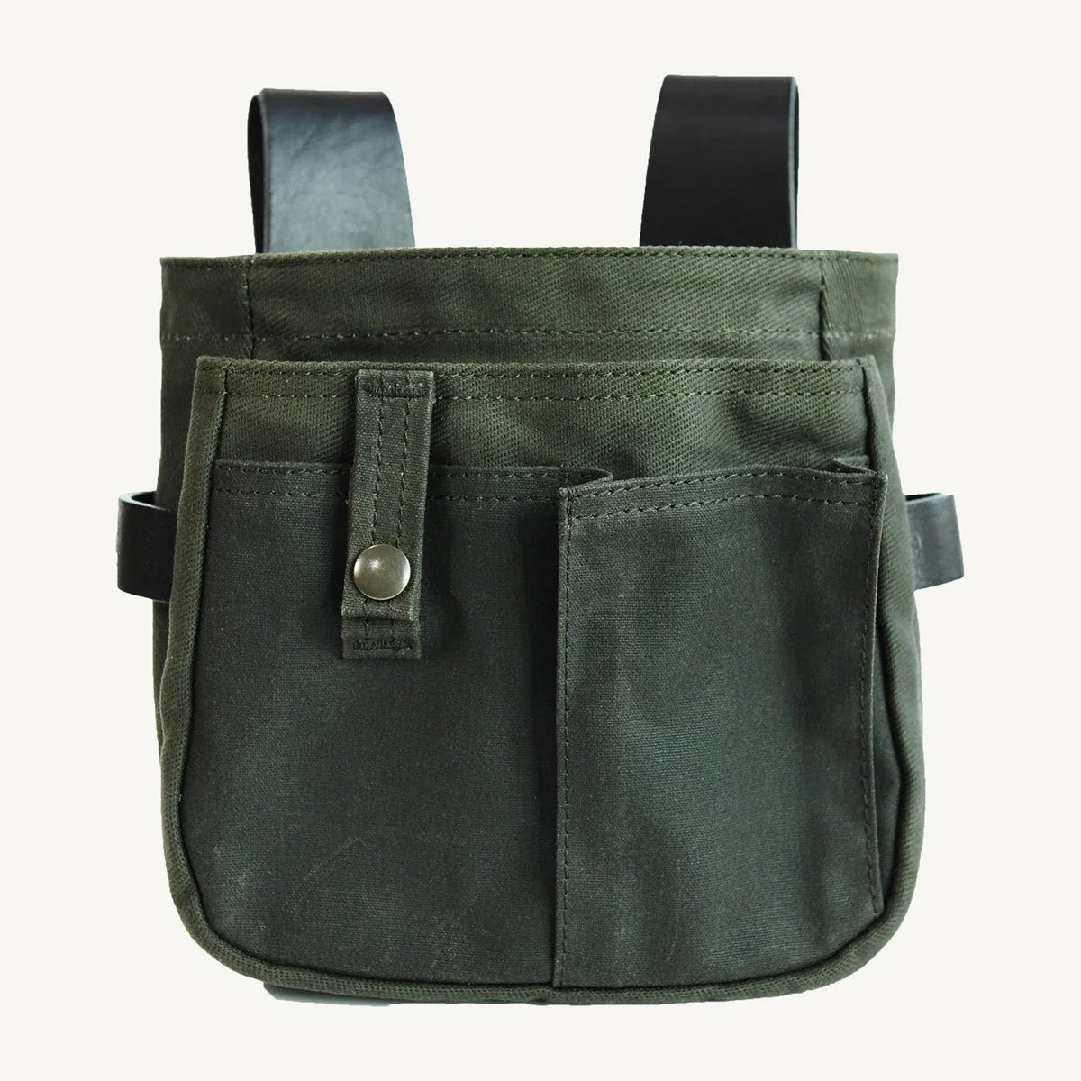 Waxed canvas and leather belt pouch on a clean background