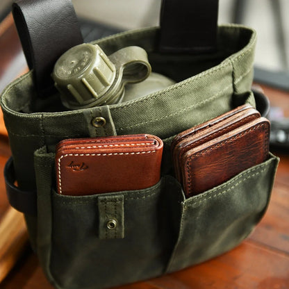 Multi-pocket waxed canvas tool pouch capacity detail