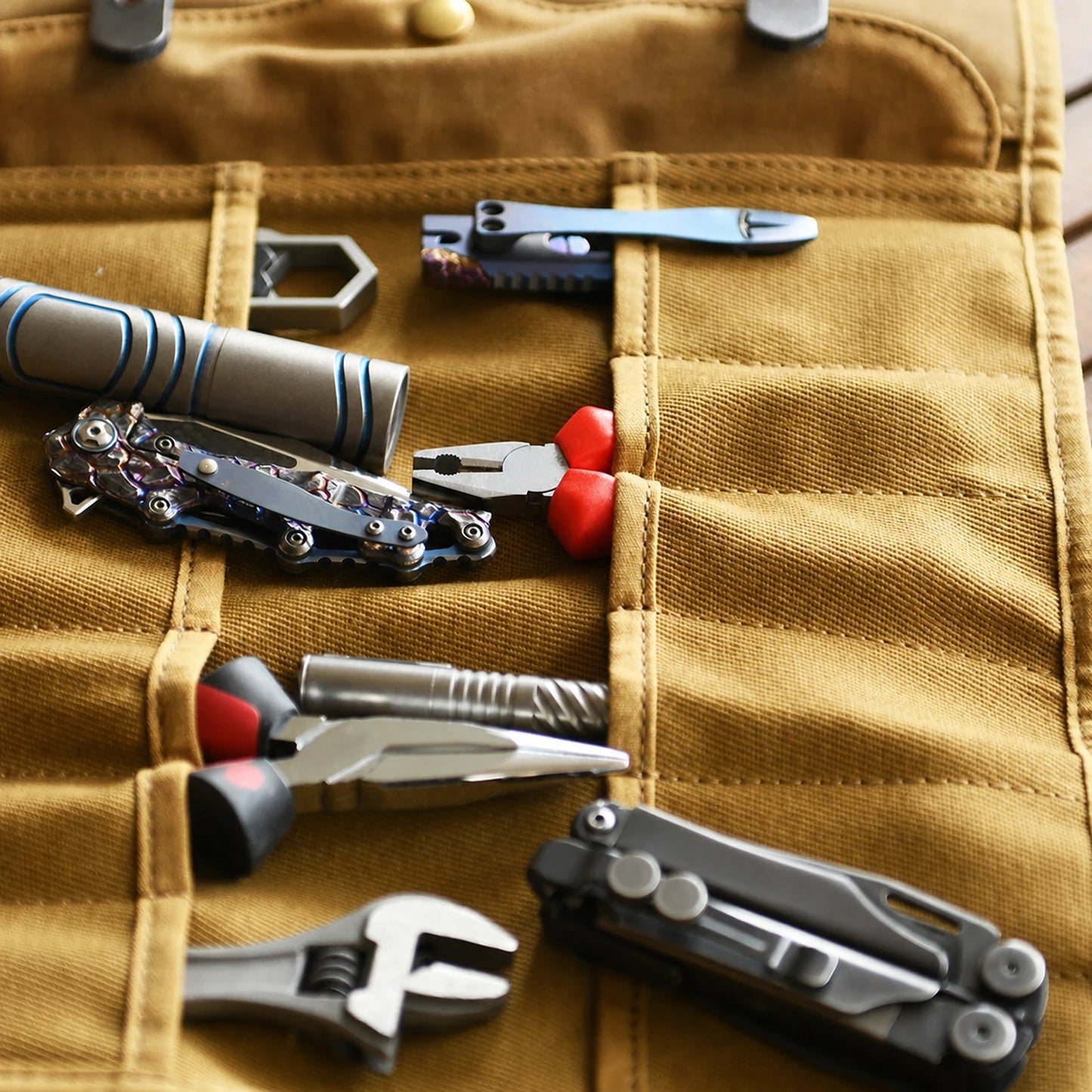 Waxed canvas tool organizer pocket layout with unbranded hand tools