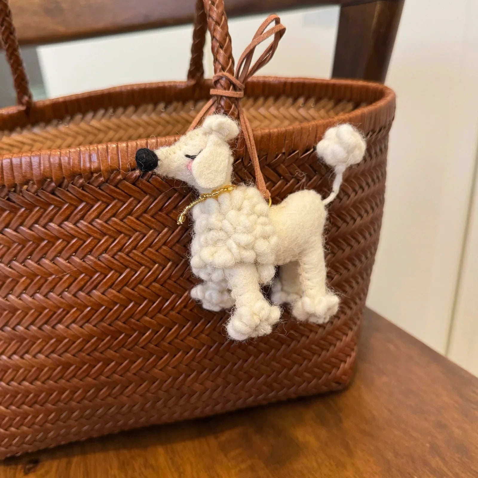 White handmade wool felt poodle bag charm with cord loop