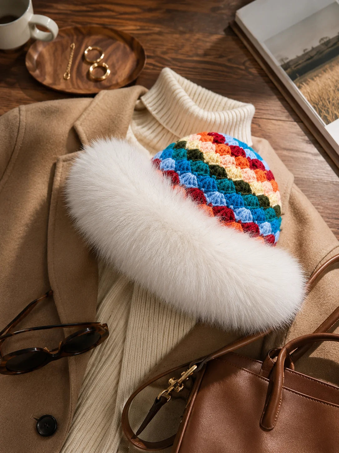 White fox-fur-trim crochet bucket hat styled with a neutral winter outfit