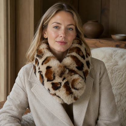 Leopard-print genuine Rex rabbit fur magnetic loop scarf worn with a neutral coat indoors