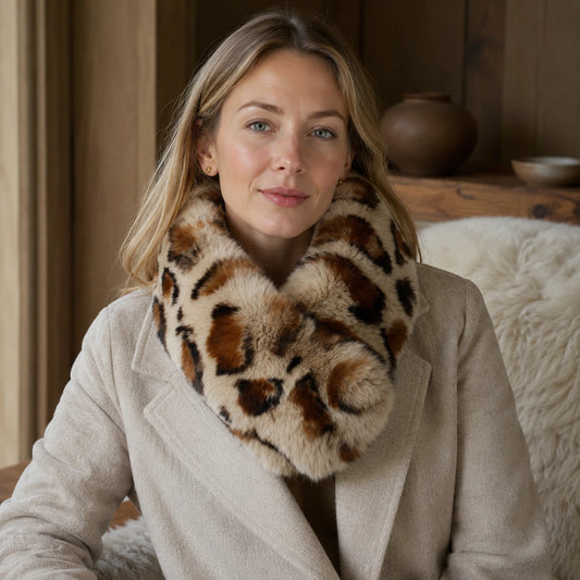 Leopard-print genuine Rex rabbit fur magnetic loop scarf worn with a neutral coat indoors