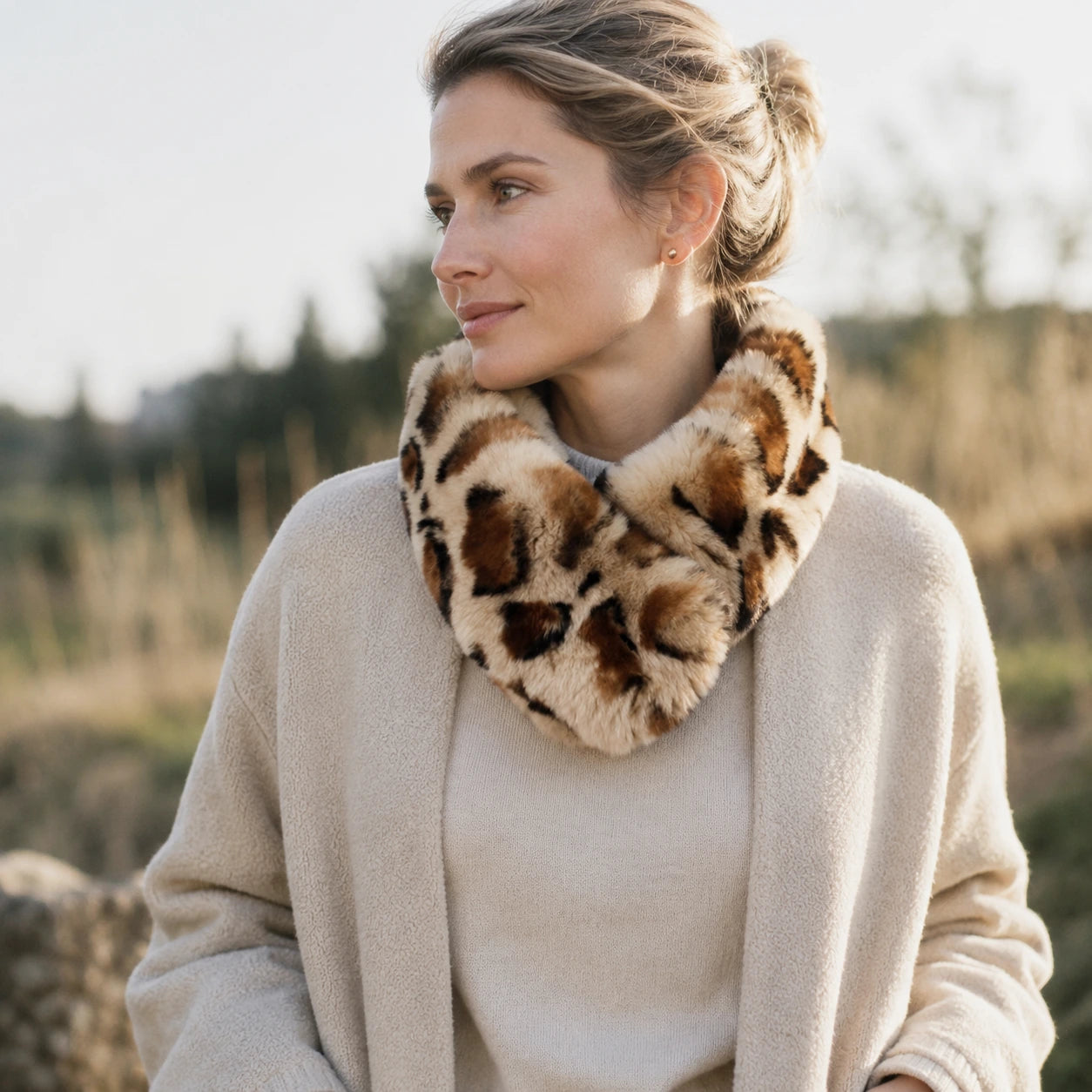 Leopard-print genuine Rex rabbit fur loop scarf worn outdoors in natural daylight