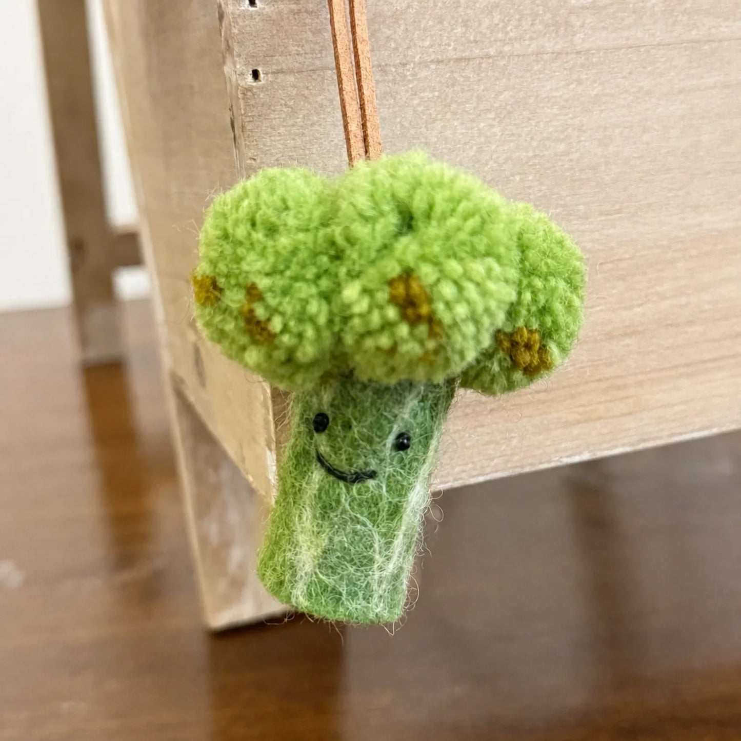 Handmade wool felt broccoli bag charm close-up