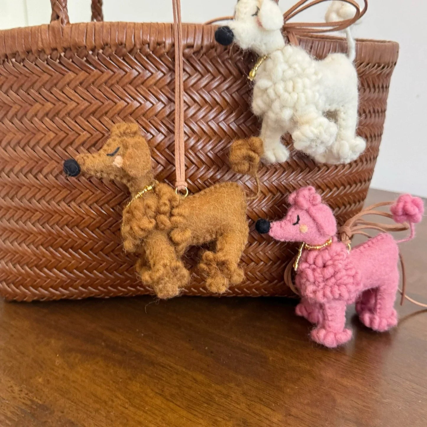 White brown and pink wool felt poodle bag charms together