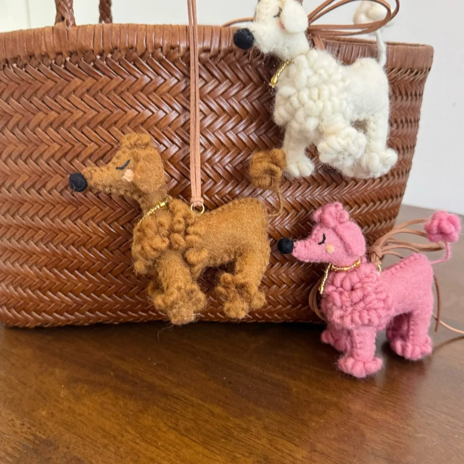 White brown and pink wool felt poodle bag charms together